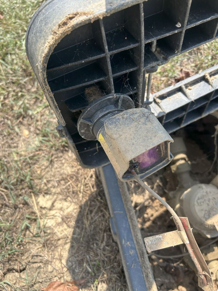 Inside the water meter box, showing the cellular part of the meter